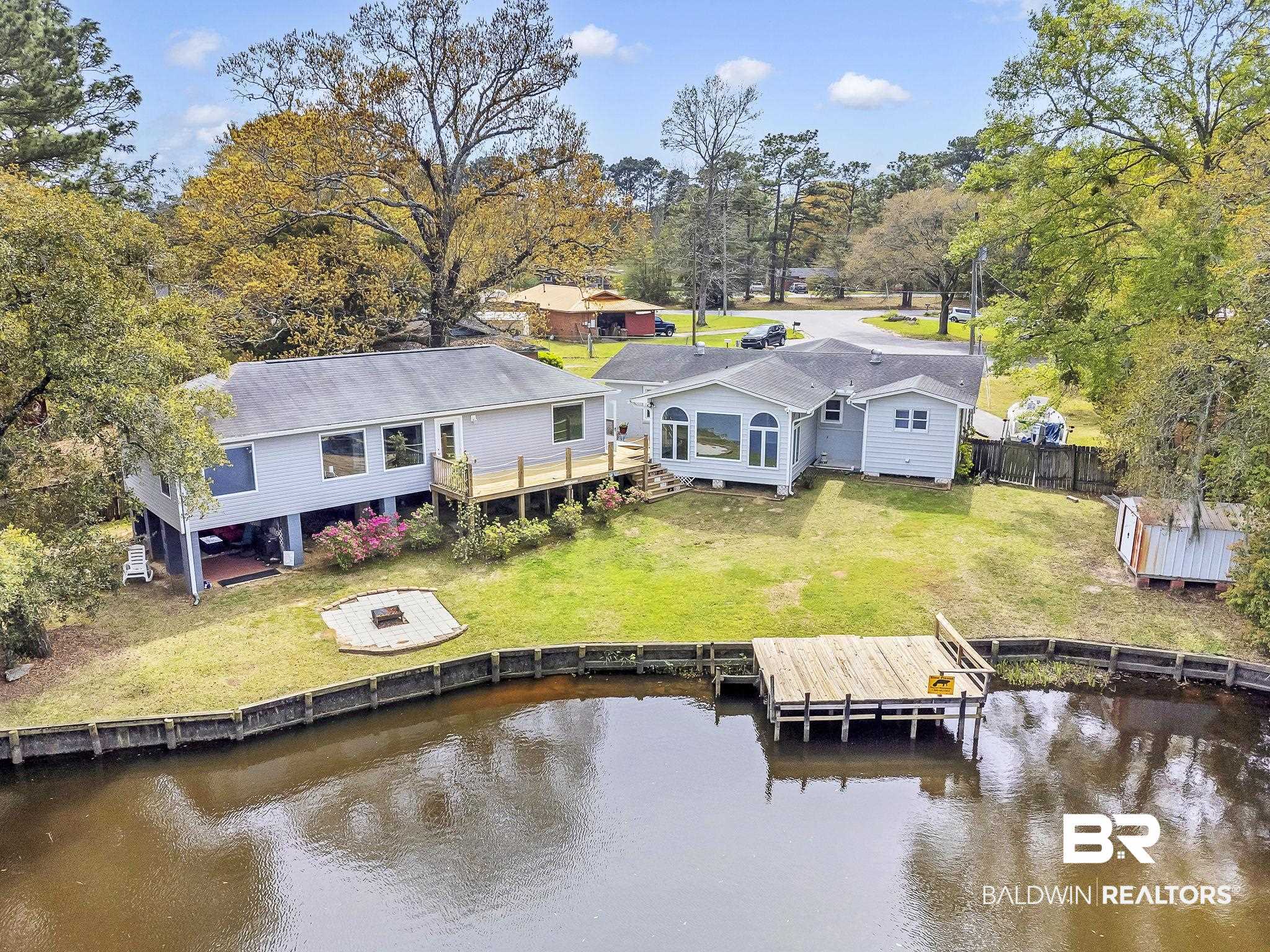 2901 Alston Court Mobile, AL 36605 - Photo 1 of 59 Aerial view with a deck with water view, fence, and a yard