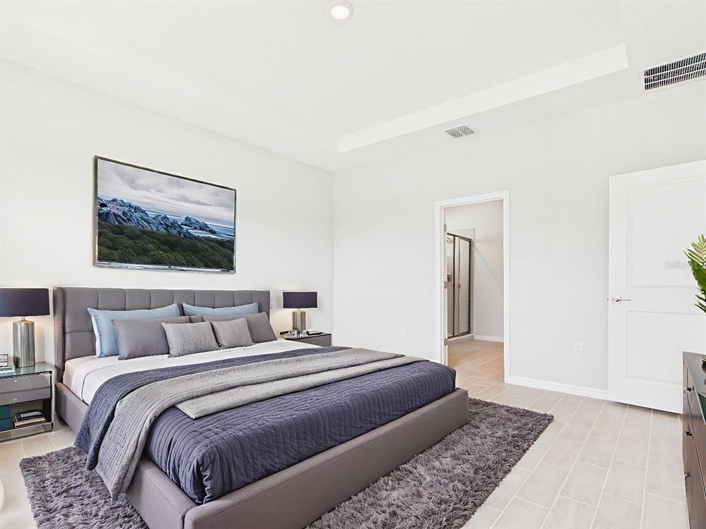 8419 North Inca Way Dunnellon, FL 34434 - Photo 3 of 15 a bedroom with a large bed and a rug