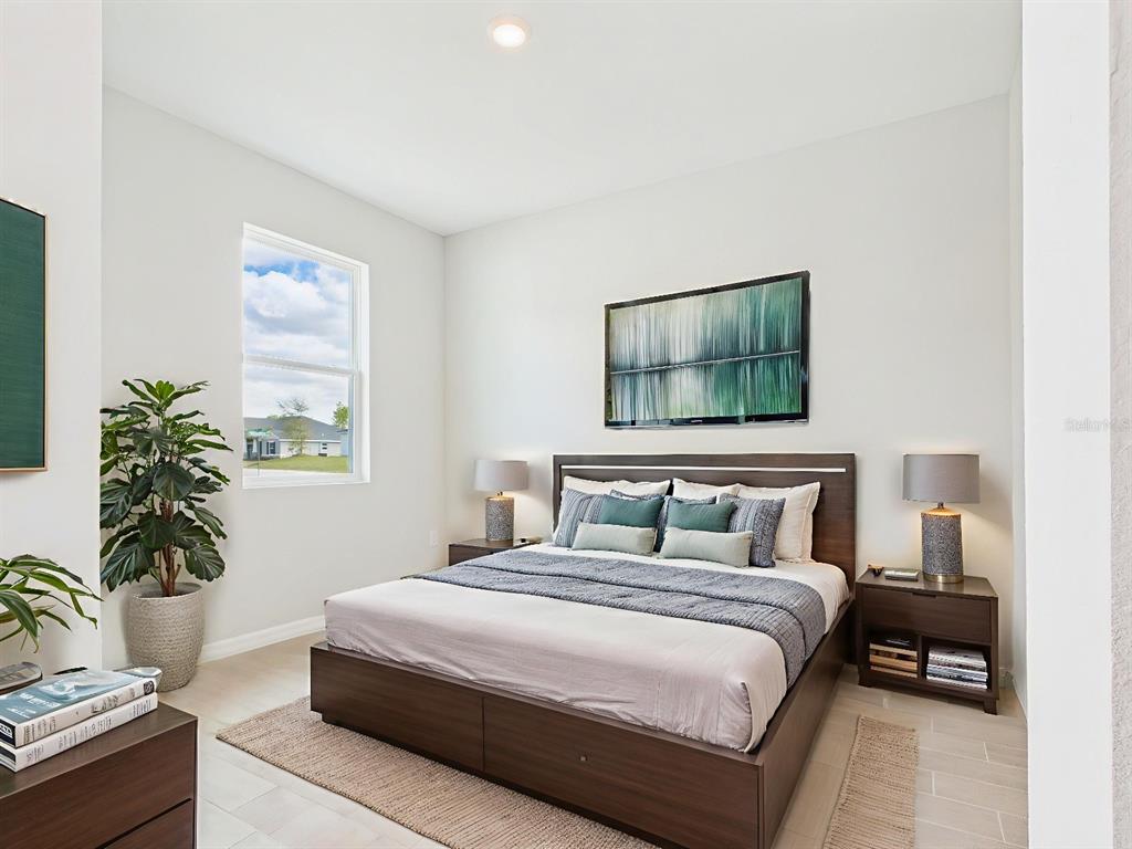 8419 North Inca Way Dunnellon, FL 34434 - Photo 9 of 15 a bedroom with a bed table and window