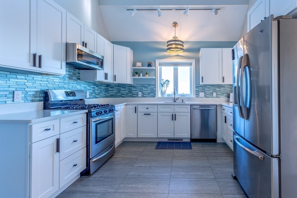 1 Lily Pond Road Plymouth, MA 02360 - Photo 12 of 40 a kitchen with stainless steel appliances granite countertop a refrigerator sink and cabinets