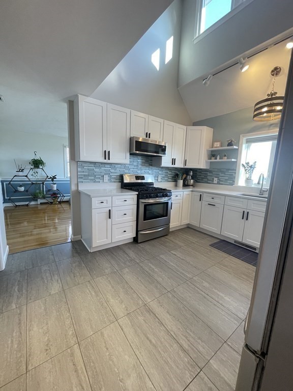 1 Lily Pond Road Plymouth, MA 02360 - Photo 16 of 40 a kitchen with stainless steel appliances granite countertop a stove sink and cabinets