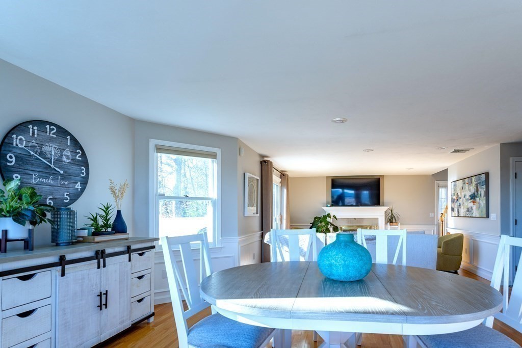 1 Lily Pond Road Plymouth, MA 02360 - Photo 20 of 40 a dining room with furniture a large window and wooden floor