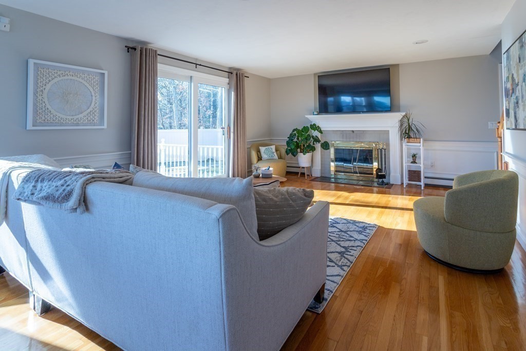 1 Lily Pond Road Plymouth, MA 02360 - Photo 22 of 40 a living room with furniture and a fireplace
