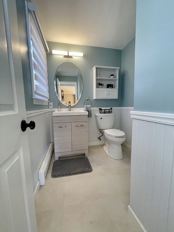 1 Lily Pond Road Plymouth, MA 02360 - Photo 23 of 40 a bathroom with a toilet a sink a mirror and a bathtub