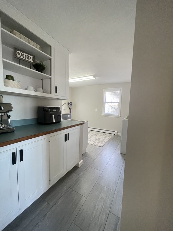 1 Lily Pond Road Plymouth, MA 02360 - Photo 24 of 40 a kitchen with cabinets a sink and wooden floor
