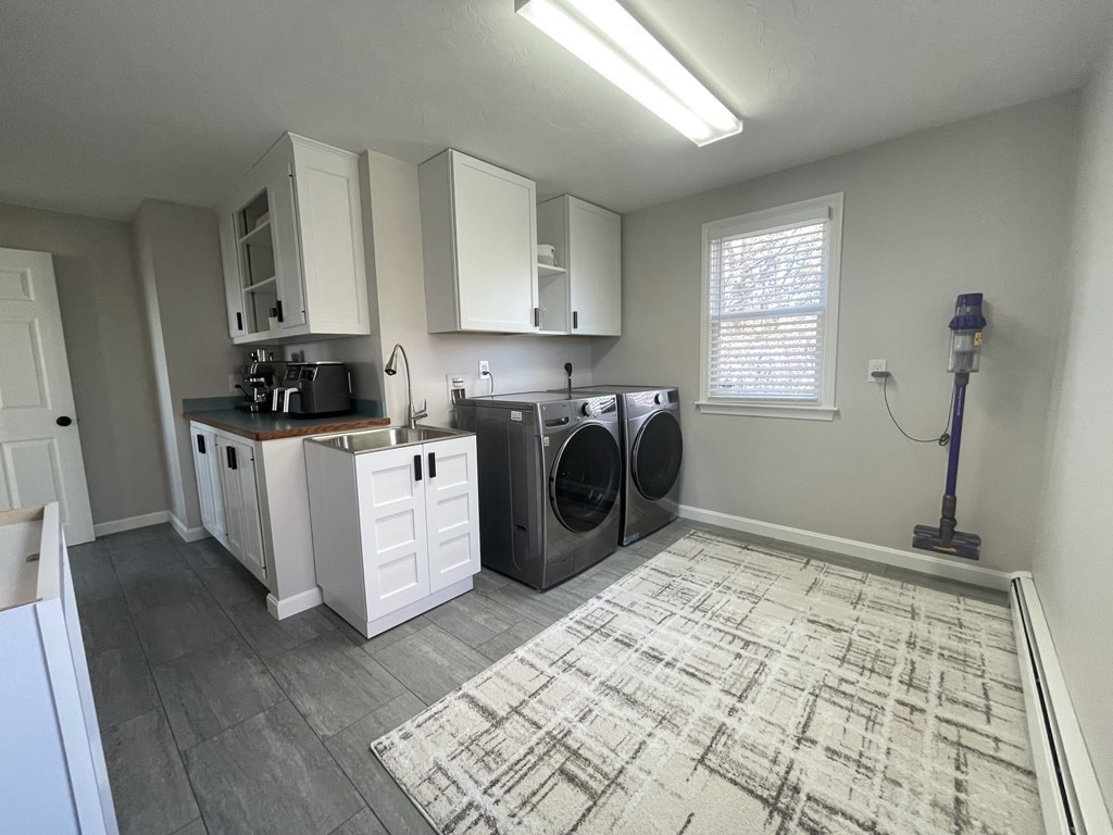 1 Lily Pond Road Plymouth, MA 02360 - Photo 25 of 40 a view of a kitchen with fridge and wooden floor