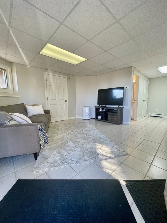 1 Lily Pond Road Plymouth, MA 02360 - Photo 38 of 40 a living room with a couch and a flat screen tv