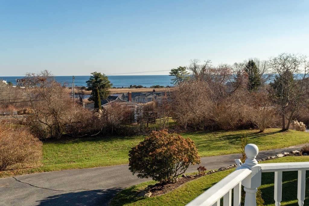 1 Lily Pond Road Plymouth, MA 02360 - Photo 9 of 40 a view of a lake with a building in the background