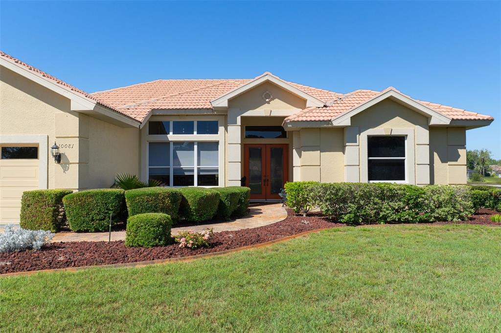 10081 Georgetown Court Weeki Wachee, FL 34613 - Photo 71 of 76 a front view of a house with a yard