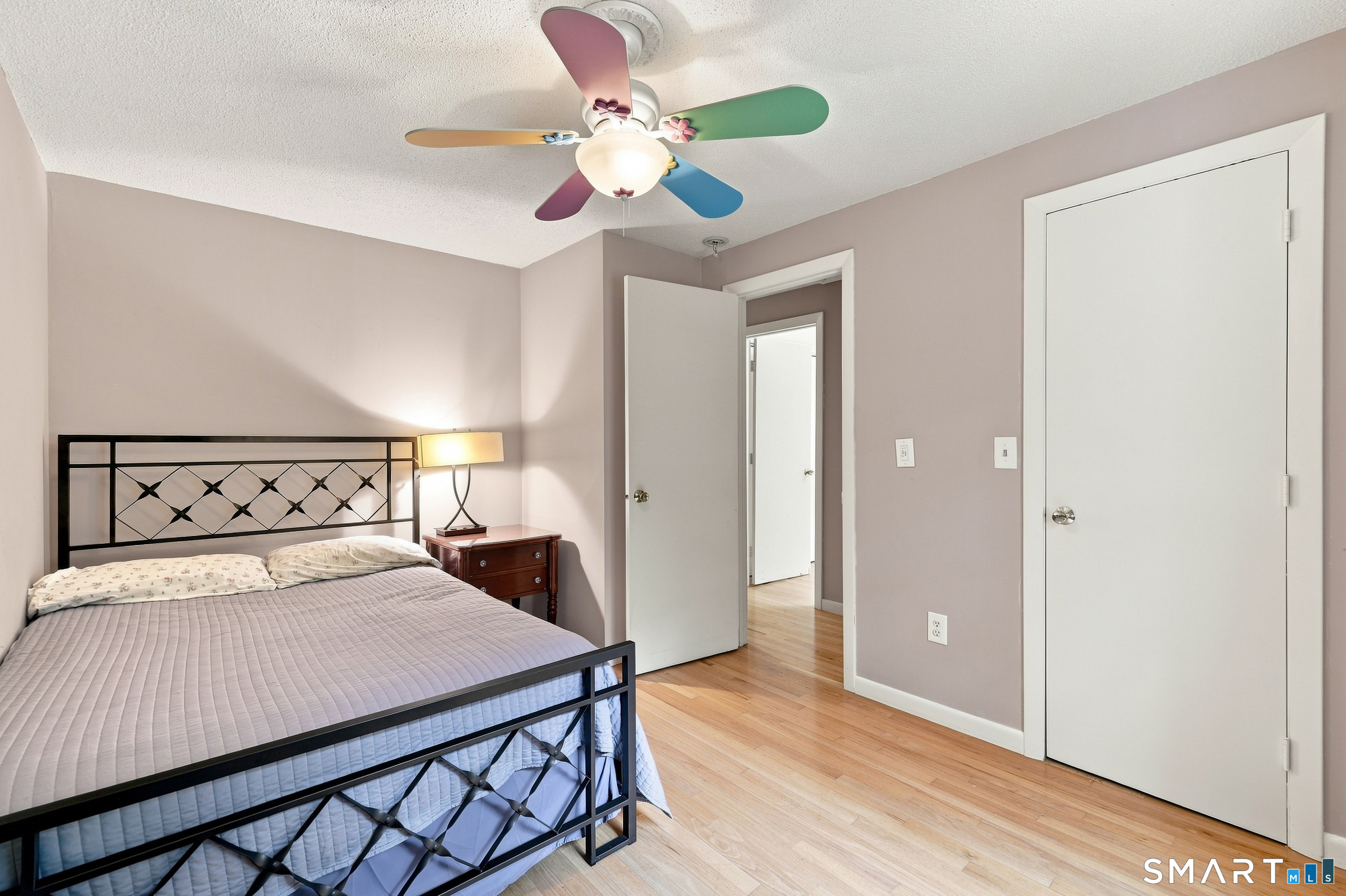2004 Boston Post Road Guilford, CT 06437 - Photo 23 of 40 Bedroom #3 with hardwood floor, large closet and ceiling fan.