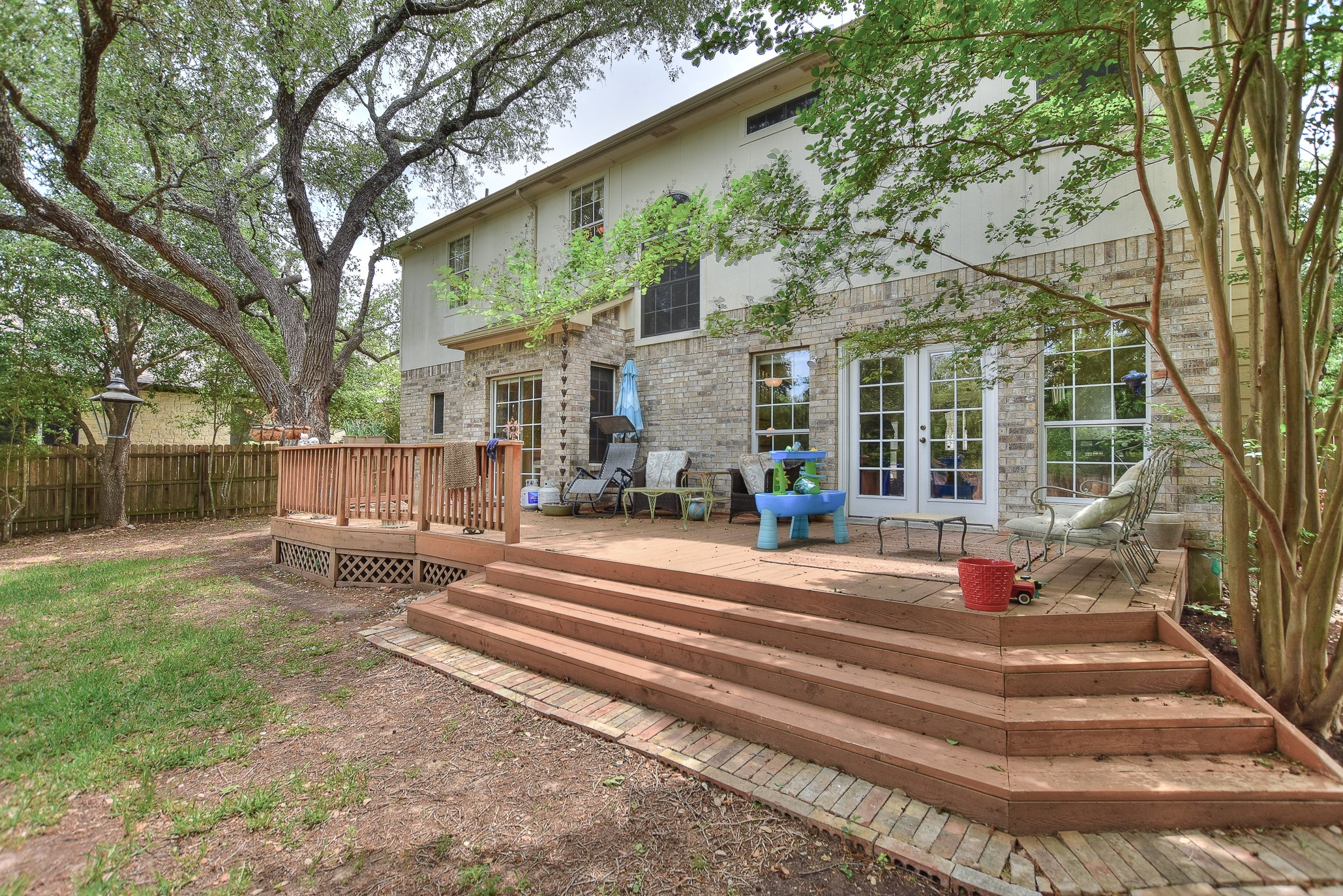 1609 Colton Way Cedar Park, TX 78613 - Photo 21 of 24 A spacious wooden deck extends from the home's rear, offering ample outdoor living space.