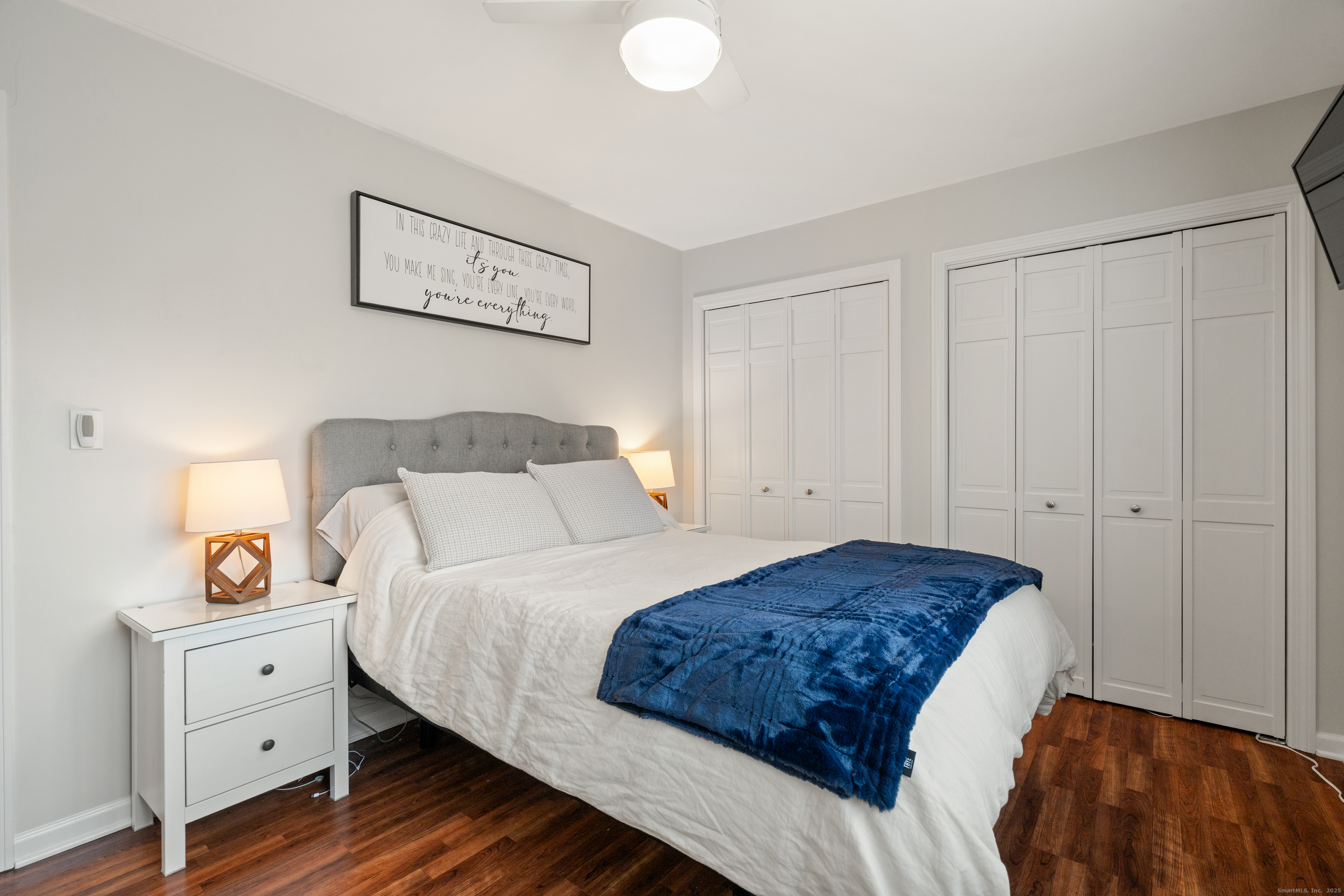 37 Riverside Avenue, Unit D Stamford, CT 06905 - Photo 23 of 29 a bedroom with a bed and a window