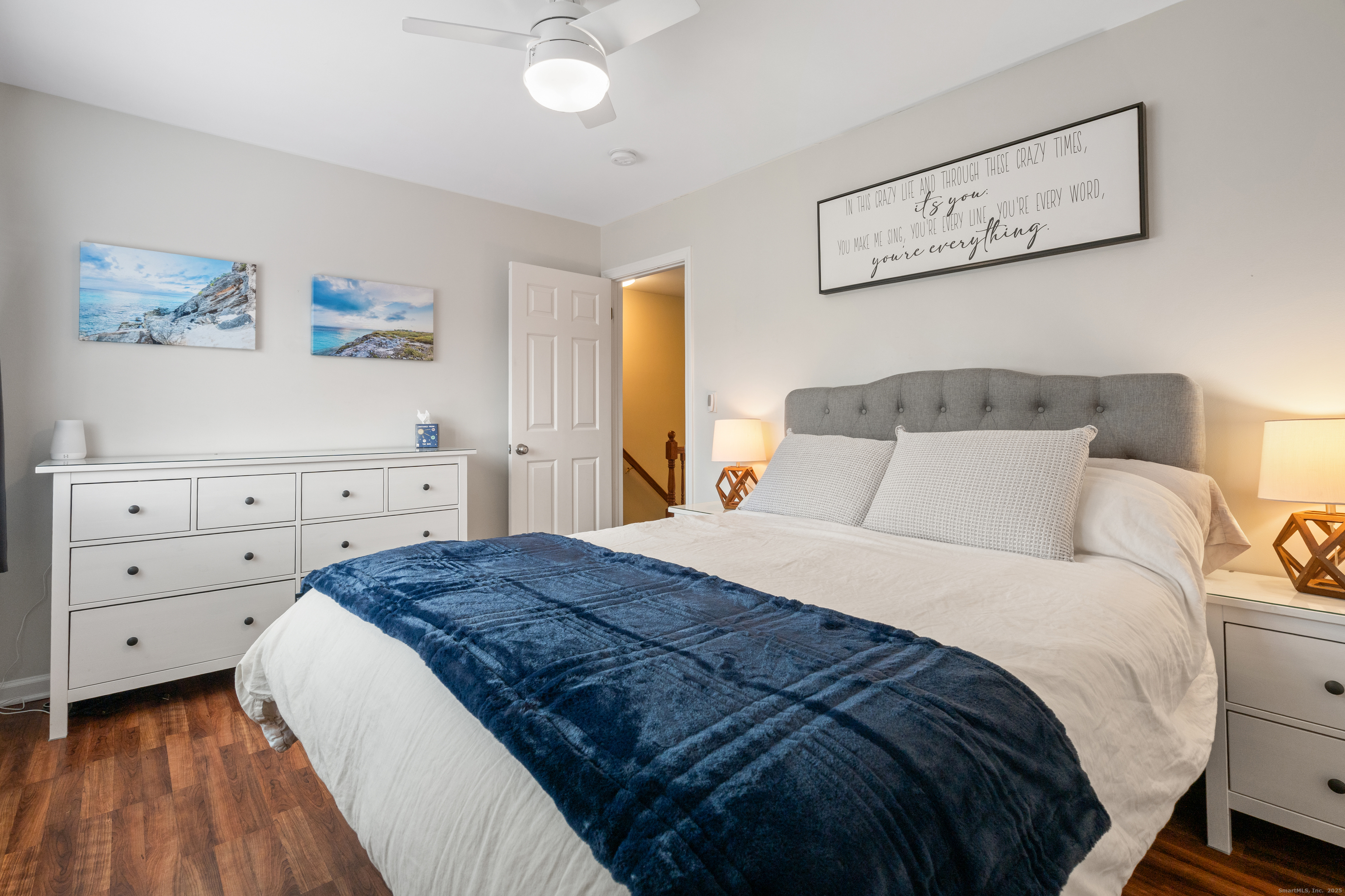 37 Riverside Avenue, Unit D Stamford, CT 06905 - Photo 24 of 29 a bedroom with a bed and a cabinets