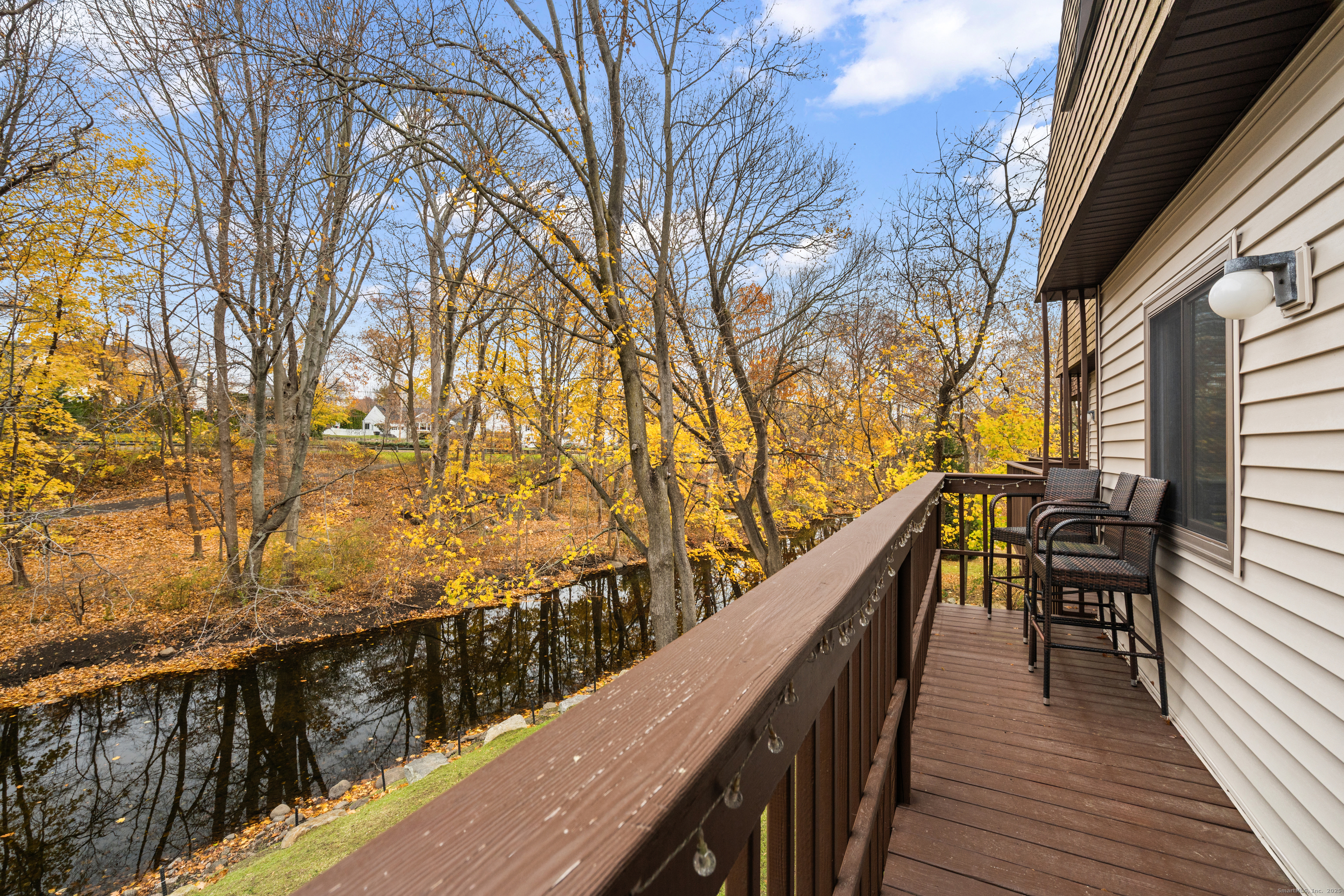 37 Riverside Avenue, Unit D Stamford, CT 06905 - Photo 26 of 29 a view of balcony with wooden floor and fence