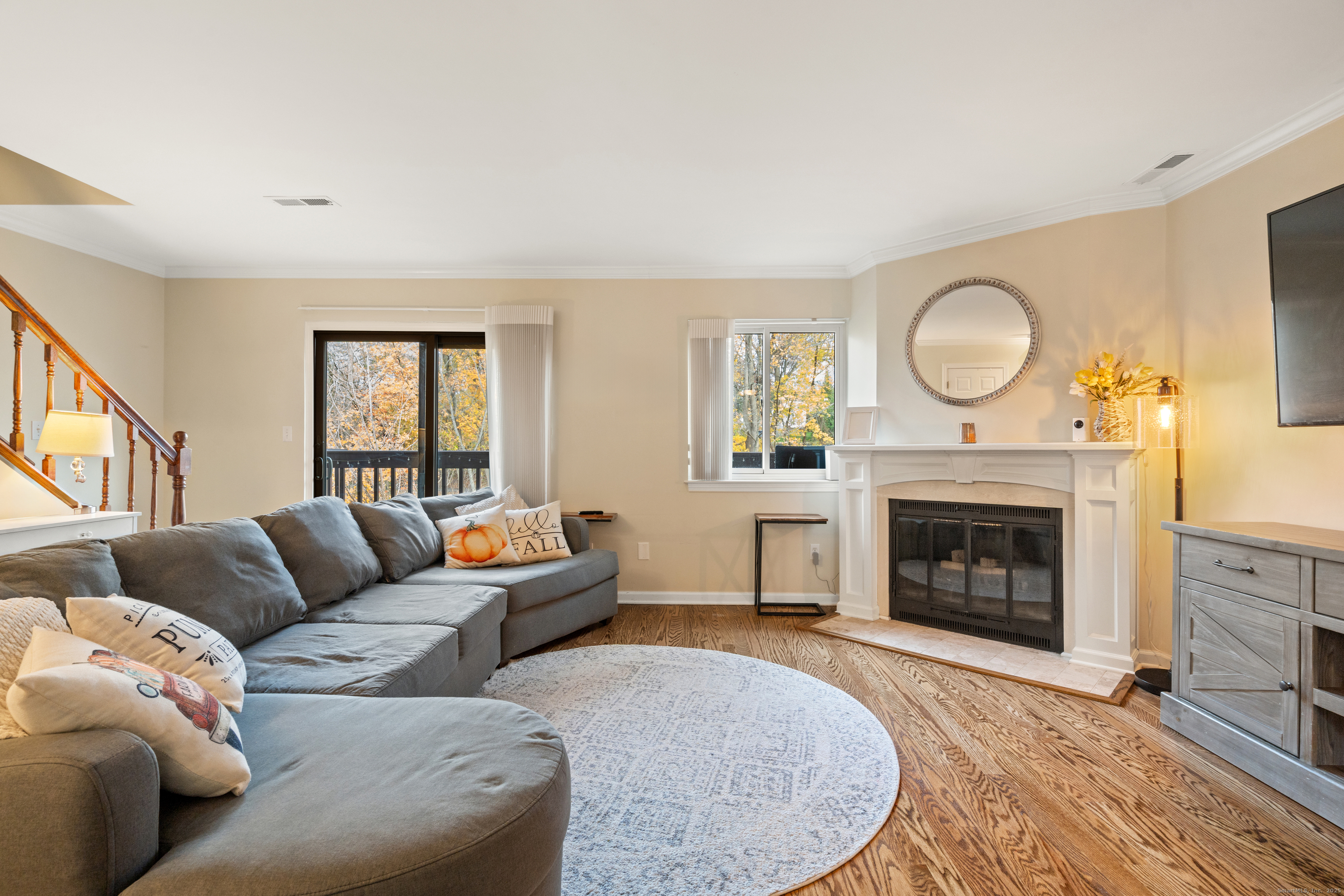 37 Riverside Avenue, Unit D Stamford, CT 06905 - Photo 8 of 29 a living room with furniture a fireplace and window