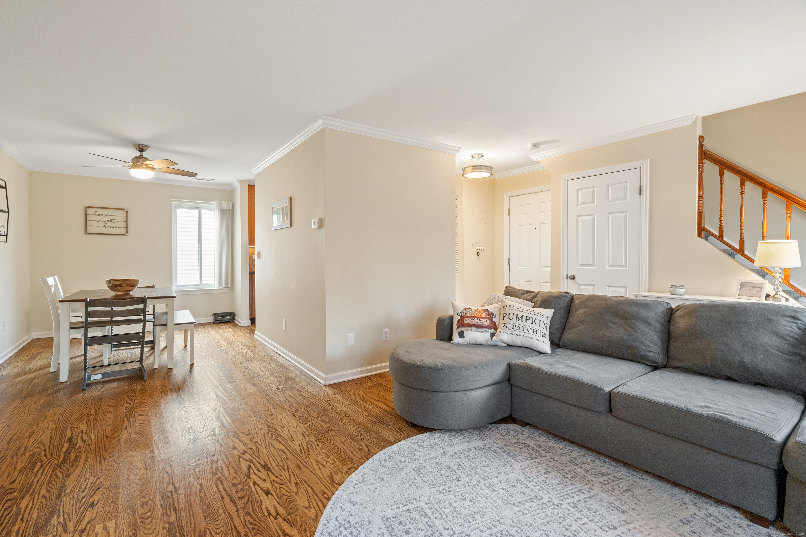 37 Riverside Avenue, Unit D Stamford, CT 06905 - Photo 9 of 29 a living room with furniture and a wooden floor
