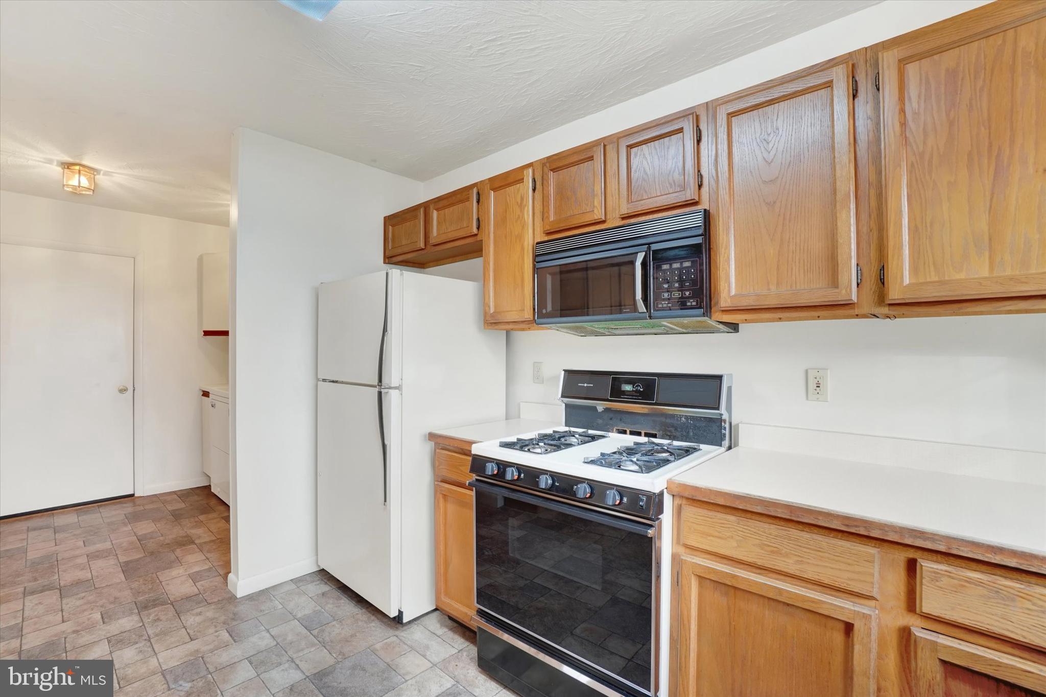 34 Jean Lo Way York, PA 17406 - Photo 10 of 27 a kitchen with granite countertop cabinets stainless steel appliances and wooden cabinets