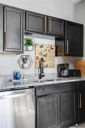 a kitchen with sink and a stove