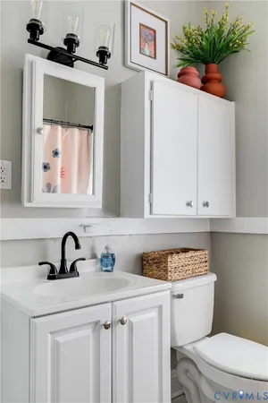 a view of a dining room with furniture and a potted plant