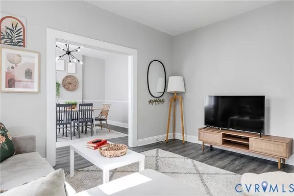 a living room with furniture and a flat screen tv