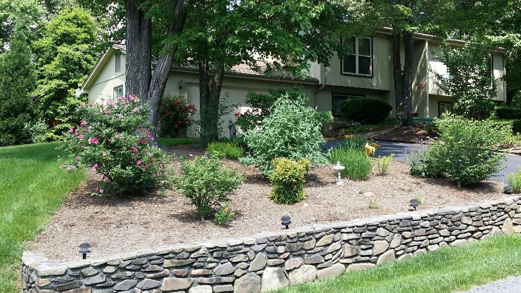 43 Willow Circle Blue Ridge, VA 24064 - Photo 41 of 43 a front view of a house with a yard and fountain