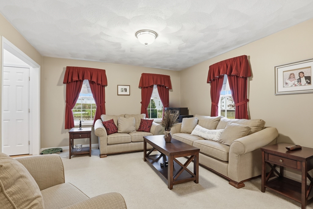 233 Bartholomew Street Peabody, MA 01960 - Photo 15 of 37 a living room with furniture and a window