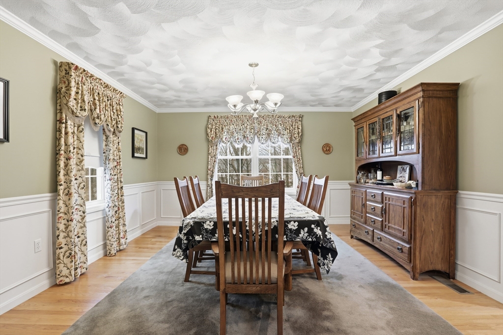 233 Bartholomew Street Peabody, MA 01960 - Photo 18 of 37 a view of a livingroom with furniture and a chandelier