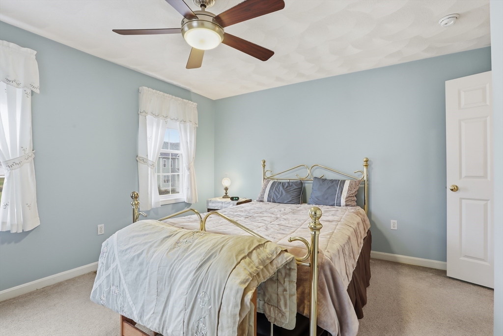 233 Bartholomew Street Peabody, MA 01960 - Photo 21 of 37 a bedroom with a bed and window