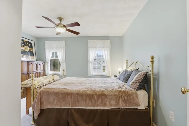 a bedroom with a bed and window