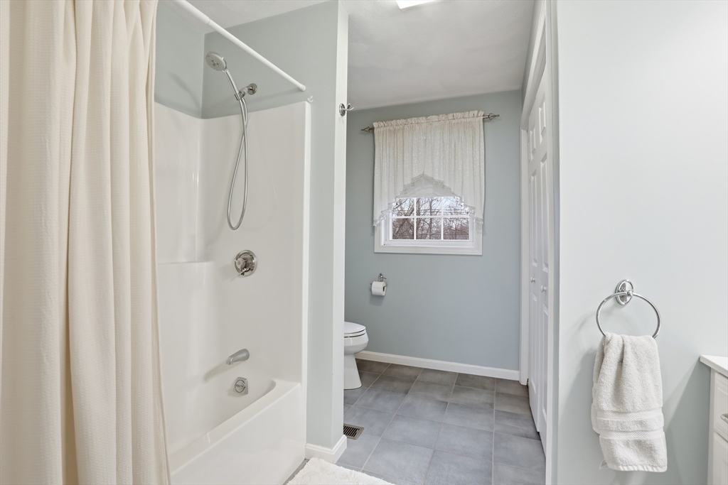 233 Bartholomew Street Peabody, MA 01960 - Photo 25 of 37 a bathroom with a shower and a toilet