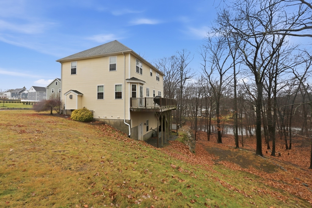 233 Bartholomew Street Peabody, MA 01960 - Photo 33 of 37 a front view of a house with a yard