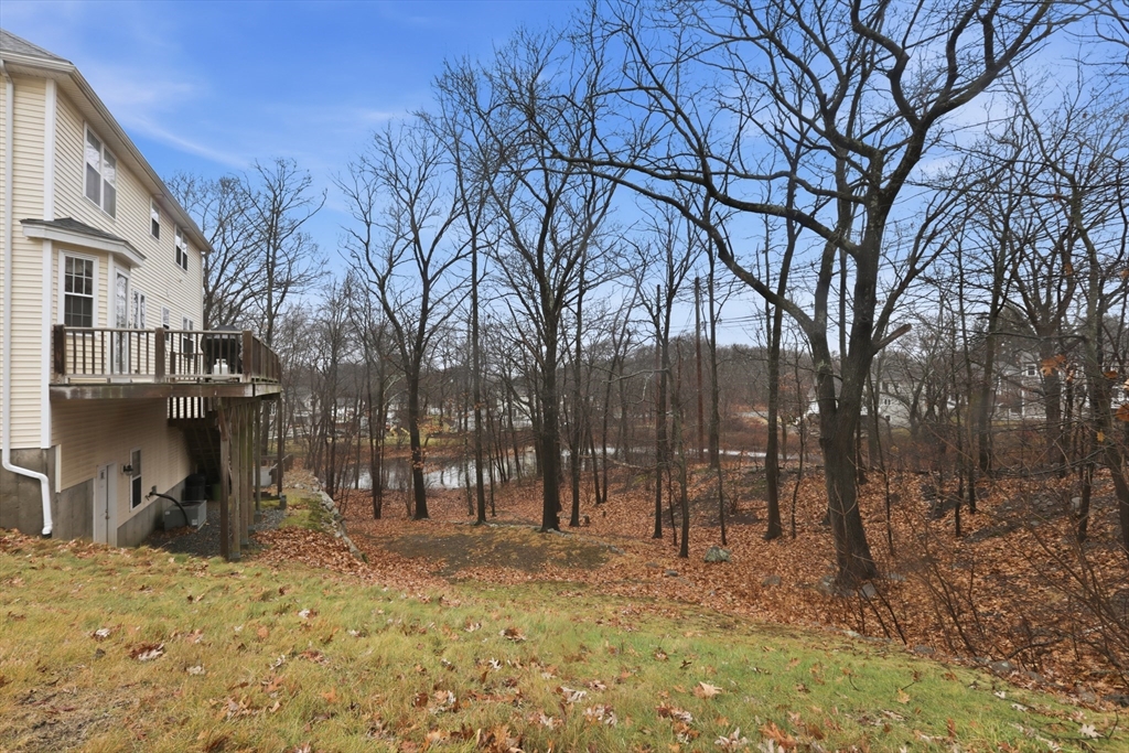233 Bartholomew Street Peabody, MA 01960 - Photo 35 of 37 a backyard of a house with lots of green space