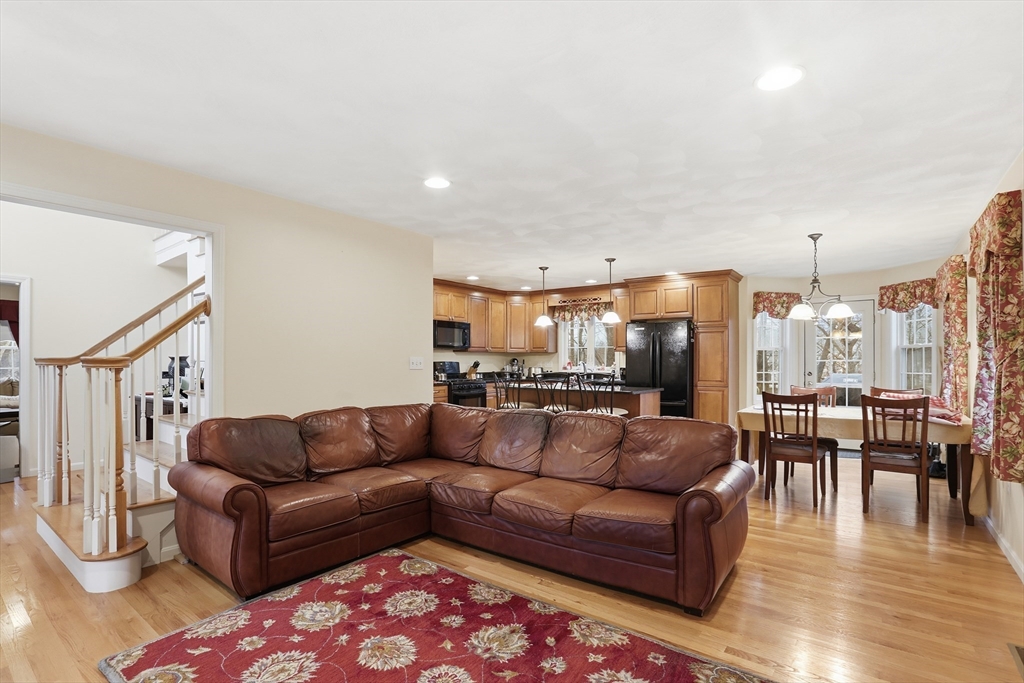 233 Bartholomew Street Peabody, MA 01960 - Photo 10 of 37 a living room with furniture and a dining table