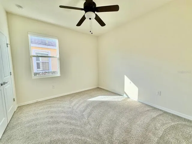 a view of a big room with carpet