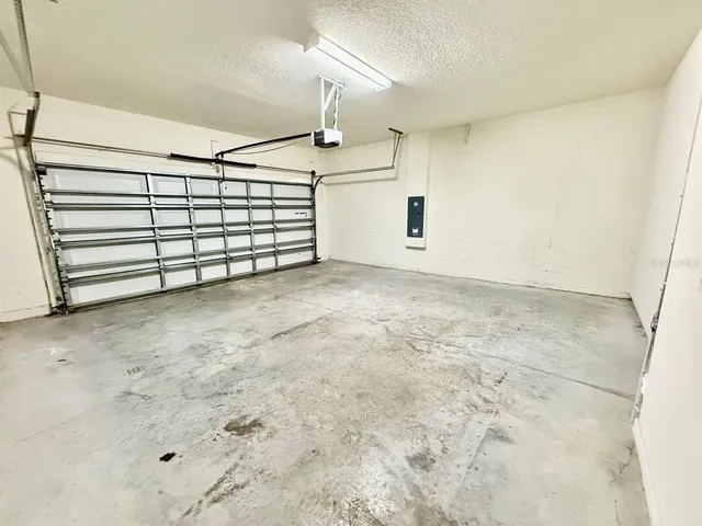 a view of swimming pool with a table and chairs