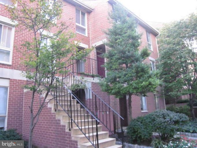 35 Andrew Place, Unit R112 Baltimore, MD 21201 - Photo 2 of 20 a view of a wooden house with a street