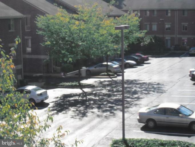 35 Andrew Place, Unit R112 Baltimore, MD 21201 - Photo 11 of 20 a car parked in front of a building