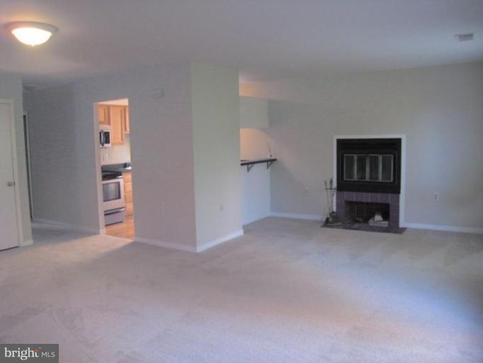 35 Andrew Place, Unit R112 Baltimore, MD 21201 - Photo 5 of 20 an empty room with closet