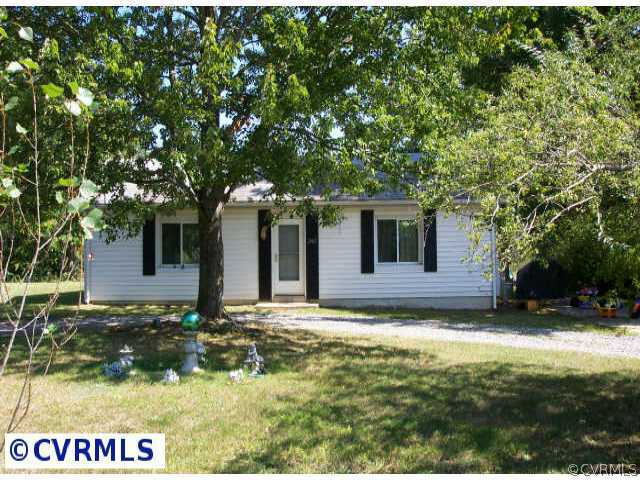 a view of house with yard