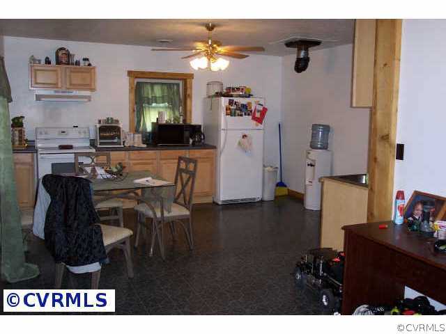 242 Buckner Road Bumpass, VA 23024 - Photo 5 of 5 a living room with furniture and a table