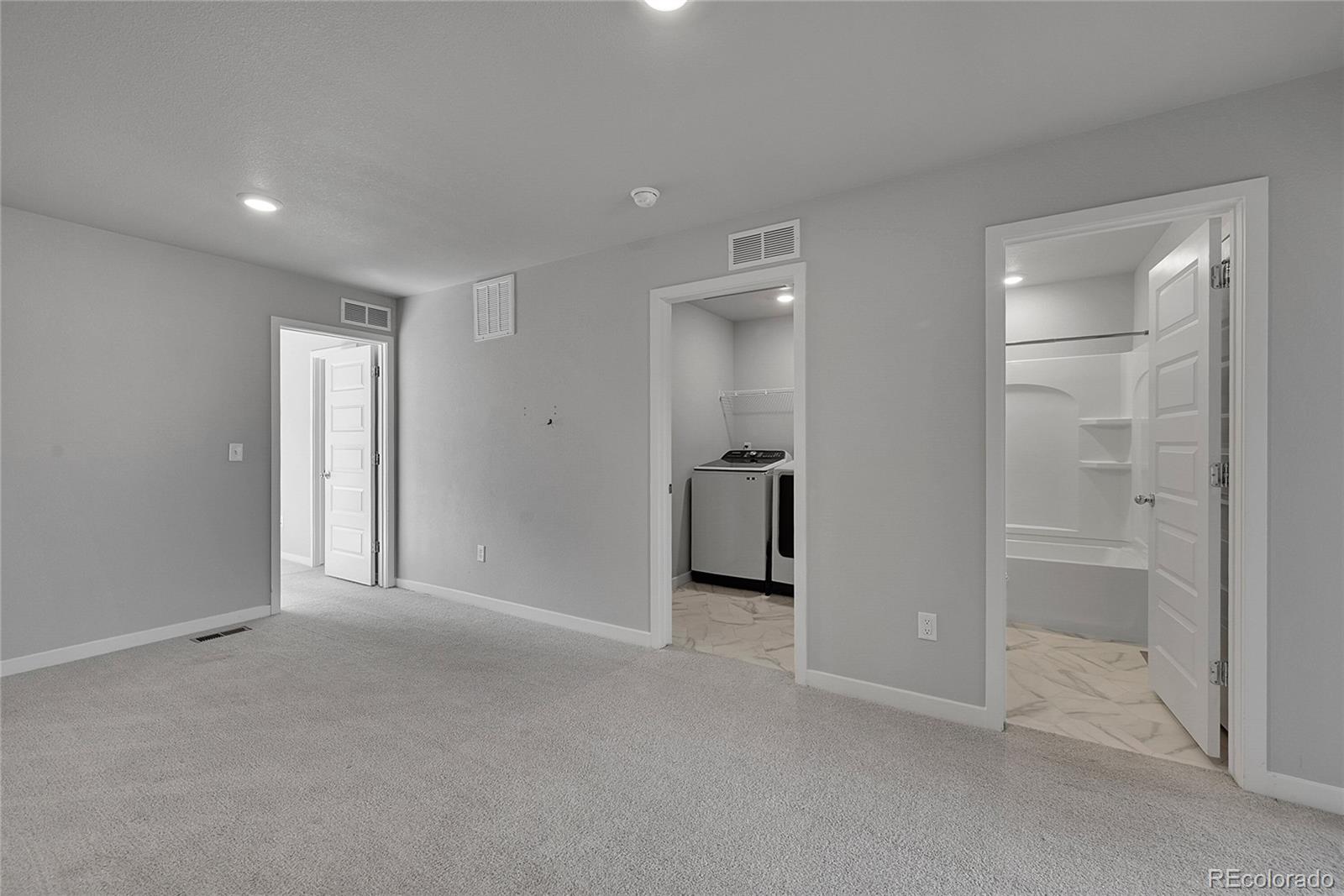 1353 Reynolds Street, Unit 3C Fort Lupton, CO 80621 - Photo 12 of 31 wooden floor and closet in a room