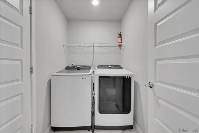 a utility room with washer and dryer