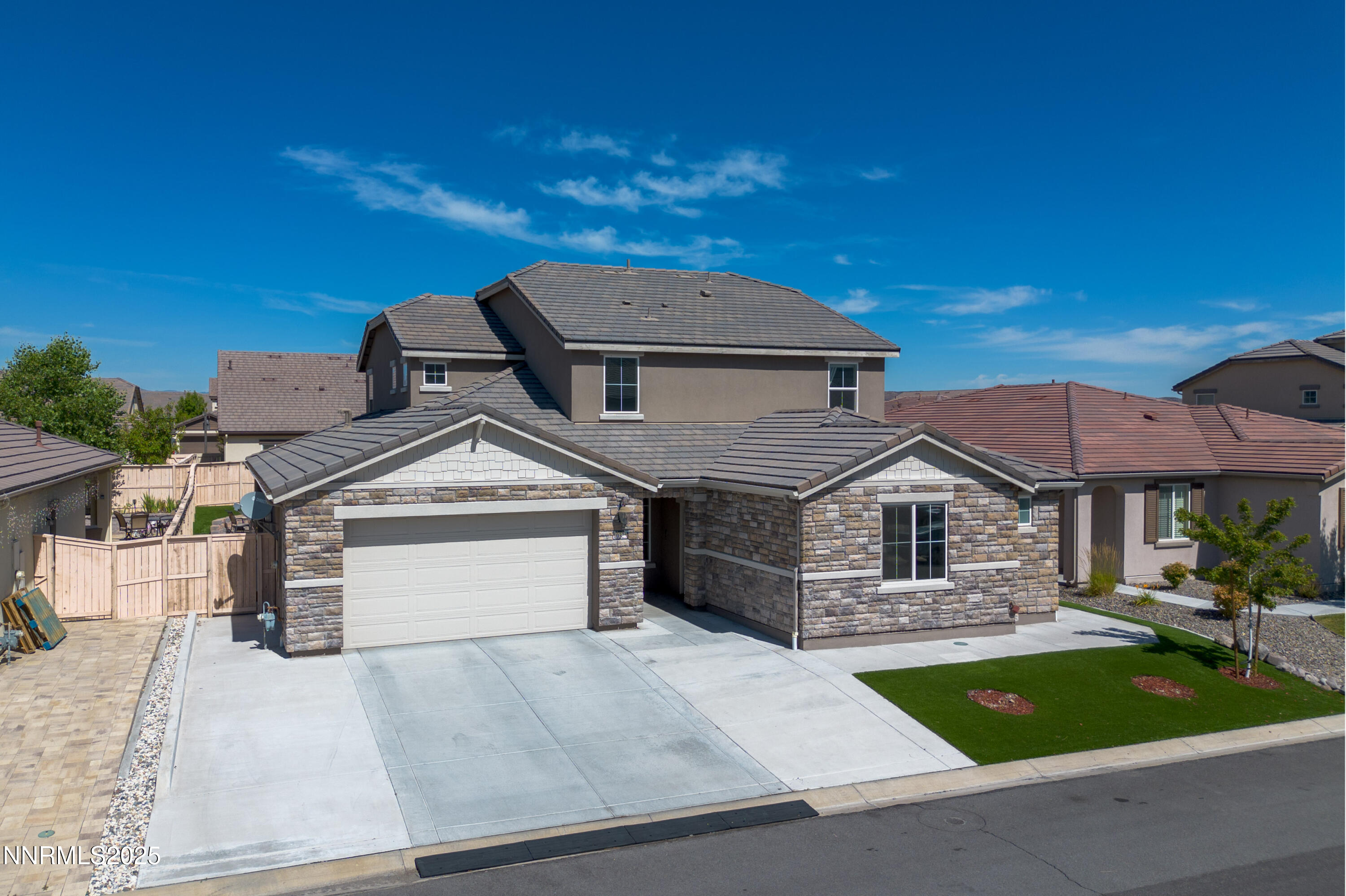 10325 Rollins Drive Reno, NV 89521 - Photo 1 of 1 a front view of a house with a garden
