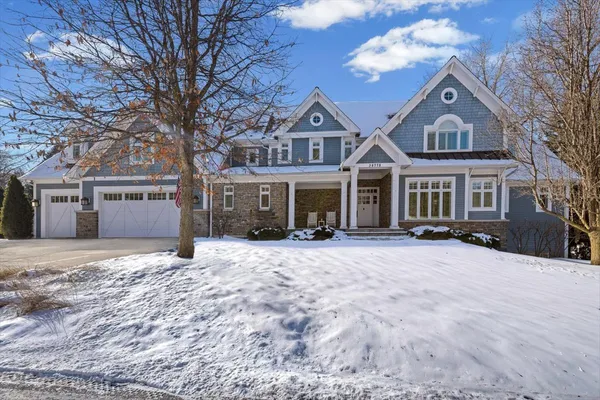 a kitchen with stainless steel appliances granite countertop wooden cabinets and a stove top oven