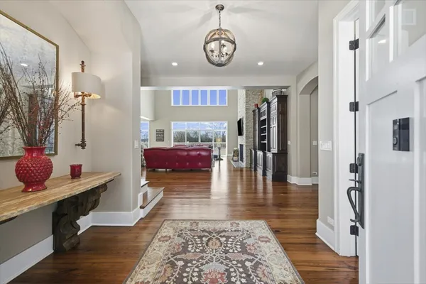 a large kitchen with stainless steel appliances granite countertop a stove a sink dishwasher and a refrigerator