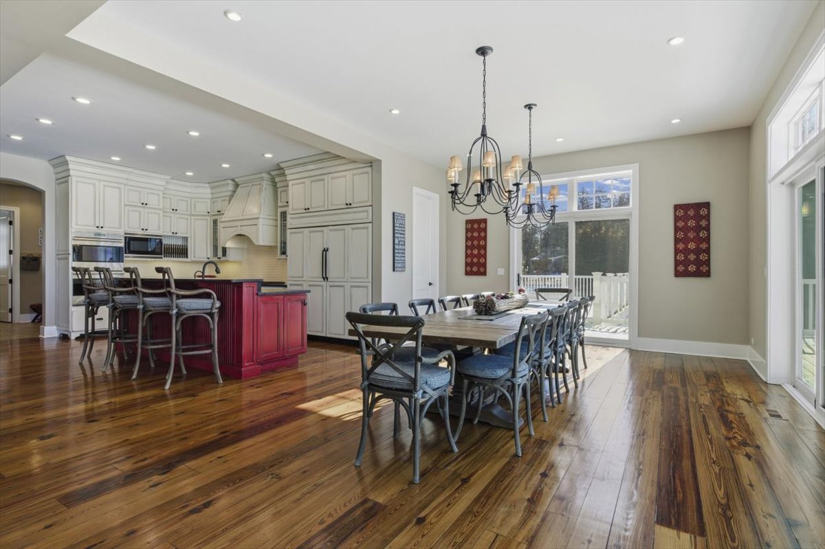 38778 North Ackerman Road Antioch, IL 60002 - Photo 12 of 82 a view of a dining room with furniture and wooden floor