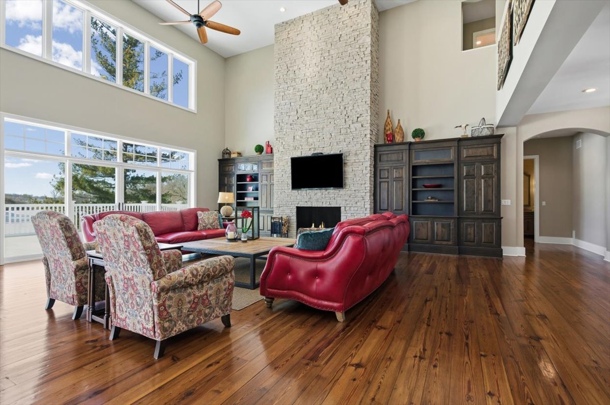 38778 North Ackerman Road Antioch, IL 60002 - Photo 15 of 97 a living room with furniture a fireplace and a flat screen tv
