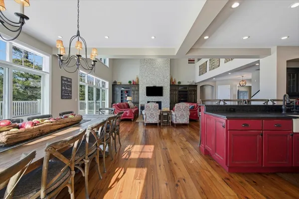 a living room with furniture and a chair