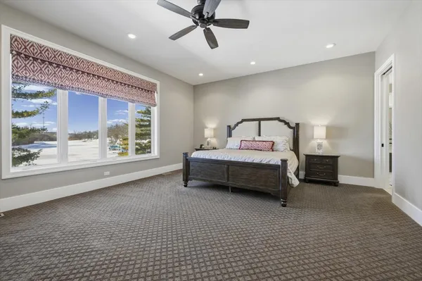 a view of a livingroom with furniture and a ceiling fan