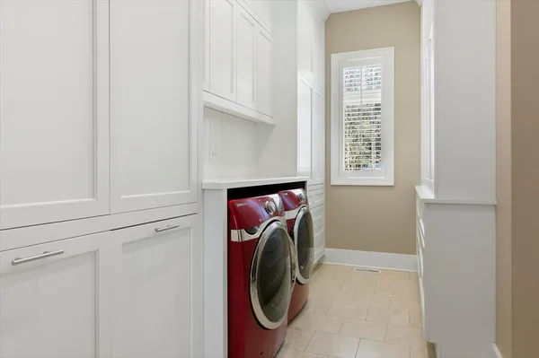 a bathroom with a sink and a washer dryer